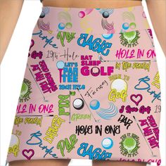 a woman's pink skirt with lots of colorful words on the front and bottom