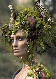 a woman with horns and moss on her head