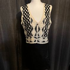 a white and black top on a mannequin