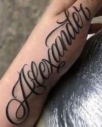 a person with a tattoo on their arm and the word awesome written in cursive writing