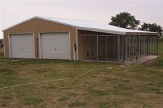 two garages in the middle of an open field