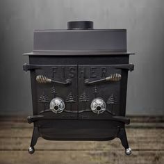 an old fashioned black stove with two burners