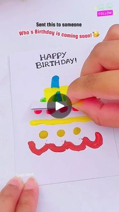 someone is cutting out a birthday card with scissors