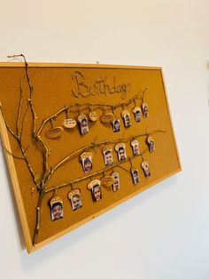 a family tree with pictures pinned to it on a cork notice board that says, birthday