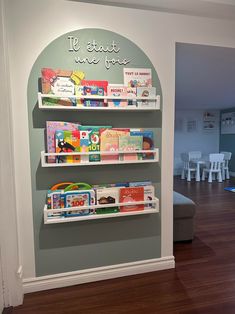 the children's bookshelf is decorated with white shelves