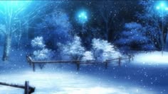 a snowy scene with trees, fence and street lights in the night time light is on