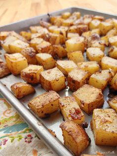 cooked potatoes on a baking sheet ready to be baked in the oven or used as an appetizer