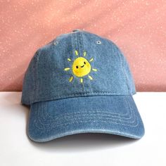 "Cute sun embroidered dad hats, perfect for any occasion and season! Brighten your cool winter days or make your sunny summer days even sunnier. This adorable cap would also make a great gift for a friend or relative! You could expect beautiful embroidery of our own hand drawn designs, embroidered by us, on a high quality hat! ☆ There may be a slight difference on every item that will make your items special and one of a kind. ☆ Due to different screen settings, colors may appear different! ☆ Pl Cute Embroidered Adjustable Baseball Cap, Fun Adjustable Cotton Dad Hat, Novelty Cotton Adjustable Baseball Cap, Fun Embroidered Snapback Hats, Fun Dad Hat With Visor, Fun Visor Dad Hat, Fun Dad Hat With Visor, One Size Fits Most, Novelty Dad Hat Adjustable Cap, Fun Adjustable Baseball Cap With Embroidered Patch