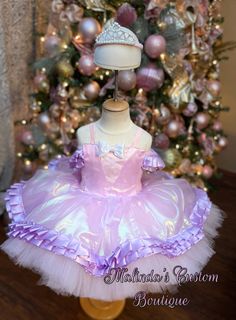 Pink and purple ballerina dress with matching pearl tiara . It's a short upper thigh cut with full fluffy layers of tulle . Purple trimmed details and great for any event. Shades of purple may be adjustable as ribbon available may not be exact shade but close. Pink Fitted Fairy Dress For Costume Party, Fitted Balletcore Fairy Dress, Balletcore Party Fairy Dress With Ruffles, Balletcore Fairy Dress With Ruffles For Party, Pink Fitted Fairy Dress For Dress-up, Fitted Pink Fairy Dress For Dress-up, Pink Fitted Princess Fairy Dress, Pink Fitted Fairy Dress For Parties, Fitted Pink Fairy Dress For Party