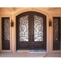 double door with two sidelights and kickplate Courtyard Doors, Exterior Doors With Sidelights, Wrought Iron Entry Doors, Wrought Iron Front Door, Custom Exterior Doors, Custom Entry Doors, Front Door Styles, Iron Front Door, Iron Entry Doors