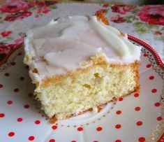 a piece of cake sitting on top of a white and red polka dot covered plate