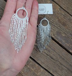 White Silver Earrings White Beaded Earringsshiny Earrings - Etsy Silver Tassel Earrings With Rhinestone Fringe, Silver Crystal Dangle Tassel Earrings, Glamorous Silver Tassel Earrings For Wedding, Silver Rhinestone Fringe Tassel Earrings For Party, Elegant Silver Tassel Earrings With Rhinestone Fringe, Silver Dangle Jewelry With Rhinestone Fringe, Silver Rhinestone Fringe Earrings For Wedding, Glamorous White Metal Chandelier Earrings, Dangle Chandelier Earrings With Silver Beads