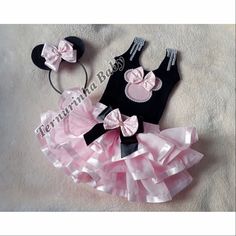 two pieces of pink and black minnie mouse outfit with matching headbands for baby girls