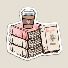 a stack of books with a cup of coffee and a bookmark sticker on top