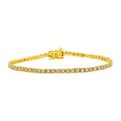 Elegant and timeless, this gorgeous 14 karat yellow gold tennis bracelet features 4.0 carat total weight of natural round brilliant cut white diamonds with a whopping 66 individual stones in all. The tennis bracelet has hinged links consisting of a single prong set diamonds each. The 7” long bracelet culminates in a secure box with tongue and safety clasp. Whether worn for daytime glamour or evening sparkle, this classic tennis bracelet is gorgeously versatile. It’s a timeless treasure she’ll enjoy wearing every day. This classic tennis bracelet makes a great gift for any special occasion, as well as a great gift for those with April birthdays! Diamonds are thought to give the wearer clarity and illuminate solutions to life’s problems, as well as encouraging abundance, strength, courage, h Bracelet Tennis, Tennis Bracelet Diamond, Jewelry Case, Tennis Bracelet, Round Brilliant Cut Diamond, Silver Diamonds, Round Cut Diamond, Gold Plated Sterling Silver, Brilliant Cut Diamond