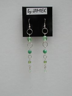 Earrings Green Beads Ring Chain Dangle in Silver Tone or Gold Tone by rrdesigns561 on Etsy Beaded Chain Dangle Jewelry For Party, Beaded Chain Dangle Party Jewelry, Green Metal Beaded Earrings For Party, Green Metal Beaded Party Earrings, Nickel-free Green Beaded Earrings For Parties, Green Wire Wrapped Jewelry For Party, Trendy Green Dangle Jewelry, Metal Drop Earrings With Beaded Chain, Metal Beaded Chain Dangle Earrings