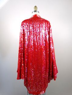 "This fabulous vintage piece is fully embellished with sequins, trimmed with glass beading and in excellent condition! It is 41\" long measured from the top hem to bottom hem. All of my items come from a smoke-free and pet-free home. If you have any questions, please don't hesitate to ask!" Glamorous Red Sequin Dress, Red Long Sleeve Glamorous Sequin Dress, Glamorous Red Long Sleeve Sequin Dress, Glamorous Red Sequin Fabric For Evening, Red Long Sleeve Sequin Dress, Red Glamorous Sequin Dress For Festive Occasions, Festive Red Sequin Fabric, Glamorous Red Sequin Festive Dress, Glamorous Red Sequin Dress For Festive Occasions