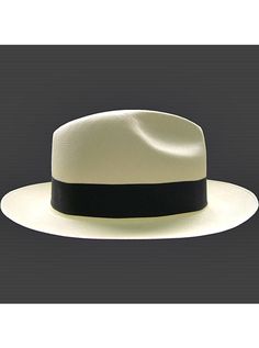 Brand: Gamboa PremiumColor: Natural Material: Toquilla Straw Brim: 7 - 8 cm. (2.76"- 3.16")Grade: 19 - 20 (Fine Fine)learn more Sweatband: Cotton Twill, 3 cm. (1.18") Crown: 10.37 - 10.87 cm. (4.1" - 4.3") Ribbon: Linen Description: A luxurious hat, handmade in Montecristi, the worldwide famous Panama Hat town in Ecuador. This Panama Fedora hat (Tuis) is a top quality, classic and elegant hat. Each hat is individually blocked and trimmed to meet the highest quality standards.Each Gamboa Premium Poncho Pullover, Elegant Hats, Premium Colors, Quality Hats, Cow Boy, Fedora Hat, Natural Material, Hat Making, Straw Hat