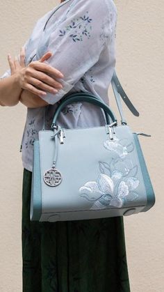 Slay Queen! 👑 This Magnolia Embroidered Bag is Giving Main Character Energy 💅 Y'all ain't ready for this lewk! 👀✨ Peep this stunner of a bag, fam! It's not just a bag, it's THE bag. 💁‍♀ 🌸 Handcrafted magnolia embroidery that's so extra, it'll make your grandma's needlework look basic AF. 🐄 Real leather, hunty! Bougie on a budget? I don't know her. 👜 Luxury Embroidered Top Handle Shoulder Bag, Luxury Embroidered Handheld Shoulder Bag, Elegant Embroidered Shoulder Bag With Double Handle, Elegant Embroidered Double Handle Shoulder Bag, Ladies' Floral Embroidery Top Handle Bag, Elegant Embroidered Tote Satchel, Luxury Embroidered Crossbody Bag, Elegant Embroidered Top Handle Satchel, Elegant Tote Bag With Floral Embroidery