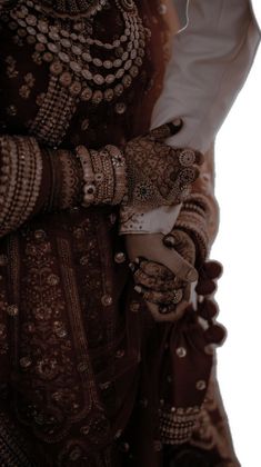 a woman in a brown and white wedding outfit