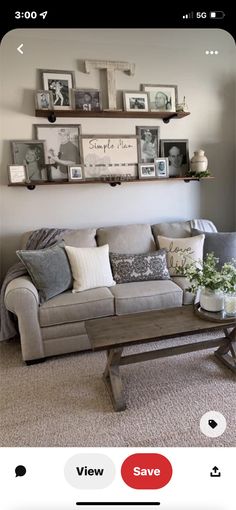 a living room filled with furniture and pictures on the wall above it's coffee table