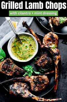 grilled lamb chops with cilantro and mint dressing on a black plate