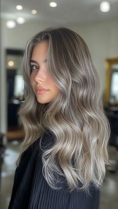 Silver balayage offers a soft, seamless blend of silver hues for a natural, sun-kissed effect. This look adds a touch of elegance and dimension to your hair. Click the pin and follow us for more stunning hair color ideas! #SilverBalayage #HairInspo #ElegantStyle #BalayageGoals #ChicHair Dark Blonde Hair With Ash Highlights, Silver Hair On Tan Skin, Beige Balayage Short Hair, Dark Icy Blonde Hair, Ash Brown Hair With Platinum Highlights, Muted Summer Hair Color, Icey Balayage Hair, Ash Blonde Balayage Dark Roots