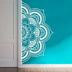 an open door with a wall sticker in the shape of a flower