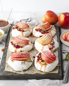 apples, cheese and other food on a tray