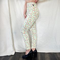 Description Versace Jeans Couture - circa 1990's high rise, straight leg white denim w/ multicolor floral print silver medusa button and hardware Condition: great minor wear, fading of print Measurements tag size: IT 38, 24" waist: 11.5" hip: 16.5" inseam: 27.5" Mid-rise Floral Print Pants For Spring, Trendy White Floral Print Pants, Mid-rise Fitted Floral Print Bottoms, Fitted Mid-rise Bottoms With Floral Print, Trendy Fitted Floral Print Jeans, Multicolor Floral Print Jeans For Spring, Fitted Multicolor Summer Jeans, Summer High Rise Jeans With Floral Print, High Rise Floral Print Summer Jeans