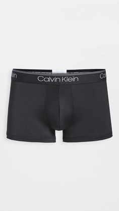 Flexible logo waistband designed to stay in place with minimal compressionLow-rise silhouette sits below hipContoured pouch, no flyShell: 95% cotton/5% elastaneWash coldImported, VietnamStyle #CKLEN44949Stock up with this 3-pack of Calvin Klein Underwear low rise trunks, which feature a no fly design, smooth fabric, and branding at the elastic waistband. Waist Measurement, Low Rise, Top Brands, Calvin Klein, Cotton Blend, Elastic, Luxury Fashion, ? Logo, Fabric