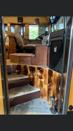 the inside of a bus with stairs leading up to it