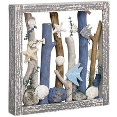 an old wooden frame with seashells and starfish on it