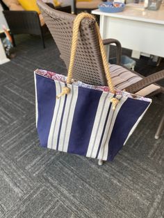 "Captain's Quarters is Sunbrella fabric with cotton lining, and jute rope like handles. It is approximately 21\"x17\" of all tote bag! It has a zipper pocket with a charm *may cause choking* and a lot of nautical. Use it as an everyday bag, Beach bag, overnight bag or whatever works for you bag!" Casual Canvas Beach Bag With Canvas Lining, Canvas Bag With Braided Handles For Daily Use, Daily Use Canvas Bag With Braided Handles, Casual Shoulder Bag With Canvas Lining For Vacation, Canvas Bag With Braided Handles For Everyday Use, Beach Canvas Bag With Leather Handles, Everyday Canvas Bag With Braided Handles, Casual Canvas Bag With Rolled Handles For Travel, Cotton Beach Bag With Braided Handles For Travel