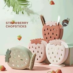 strawberries, strawberrys and utensils are arranged in the shape of animals