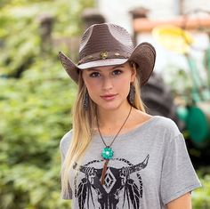 a beautiful young blond woman wearing a cowboy hat