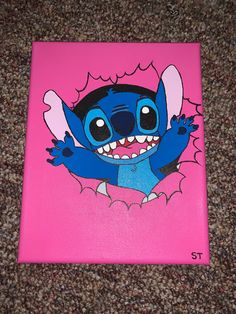 a pink canvas with a cartoon character painted on it