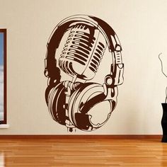 a microphone and headphones wall decal in a room with hardwood flooring on the side