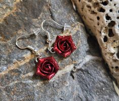 Dangly floral earrings with bloody red pearl roses and free hooks. The flowers are made from polymer clay with red pearl cover. Dia flower approx 12-13 mm Hooks - gold plated stainless steel or gold plated sterling silver 925 Material of flowers- polymer clay. Polymer clay isn't afraid of water, strong, but you must take care as any jewelry piece. Gorgeous gift for women and girls as handmade item. Sizes: Length of earrings- 1 in/ 25 mm Dia of charm 13-15 mm/ 0.5-0.6 inches across If you like th Red Dangle Flower Earrings For Valentine's Day, Red Flower Earrings With Ear Wire For Party, Red Flower-shaped Earrings With Rose Design, Red Flower-shaped Jewelry With Rose Design, Rose Red Flower Earrings For Valentine's Day Gift, Red Flower Jewelry With Rose Design, Rose Red Flower-shaped Earrings With Rose Design, Rose Red Valentine's Day Earrings With Rose Design, Rose Red Earrings With Rose Design For Valentine's Day