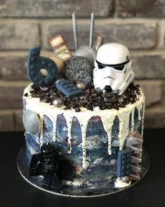 a star wars themed birthday cake is decorated with fondant, chocolate chips and marshmallows