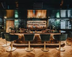 an empty bar with four chairs around it