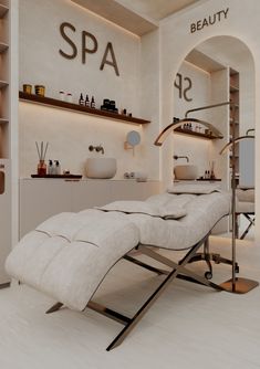 a spa room with white walls and wooden shelves