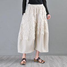 Spring Wide Leg Bottoms With Fringe, High Waist Fringe Bottoms For Spring, Bohemian Bottoms With Frayed Hem For Spring, Casual Bottoms With Tassels For Fall, Wide Leg Bottoms With Tassels, Chic Tassel Pants For Spring, Bohemian Spring Bottoms With Frayed Hem, Chic Fall Bottoms With Tassels, Spring Casual Pants With Tassels