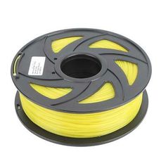 a spool of yellow pla filamant on a white background