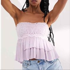 Beautiful Free People Adella Cami In Lavender Purple Color. Corset Style, Lovely Tiered Ruffles Detail At Bottom, Strapless, Lace Bodice, Smocked Detail At Back With Nice Stretch And Comfort. 69% Viscose, 19% Nylon, 12% Cotton. Lace Bodice: 95% Viscose, 5% Spandex. Brand New With Tags Hand Wash Cold. Spring Bandeau Lace Top, Spring Lace Bandeau Top, Lace Bandeau Top For Spring, Purple Strapless Top For Spring, Purple Lace Tops For Spring, Purple Lace Top For Spring, Fitted Mauve Summer Top, Fitted Mauve Top For Summer, Purple Lace Top