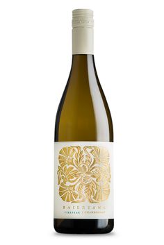 a bottle of white wine with a gold design on the front and bottom half of it