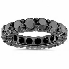 a wedding ring with black diamonds on it