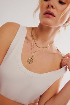 Add a little something extra with this stunning layered necklace featuring a mixture of three different chains accented by naturally-shaped, distressed charm details. * Clasp closure * Fixed length | Oversized Coin Necklace by Free People in Gold Everyday Multi-strand Layered Necklace, Multi-strand Charm Necklaces For Layering, Chunky Chain Multi-strand Necklaces For Layering, Chunky Chain Double Strand Layered Necklace, Everyday Layered Double Strand Charm Necklaces, Multi-strand Chunky Chain Necklace For Layering, Everyday Multi-strand Layered Charm Necklaces, Chunky Chain Multi-strand Layered Necklace, Everyday Multi-strand Charm Necklace With Delicate Chain