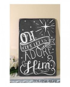 a chalkboard sign that says, come let us adore him