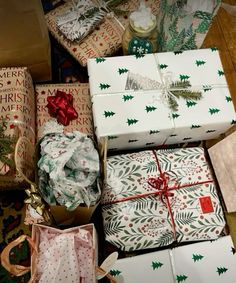 several wrapped presents sitting on the floor next to each other